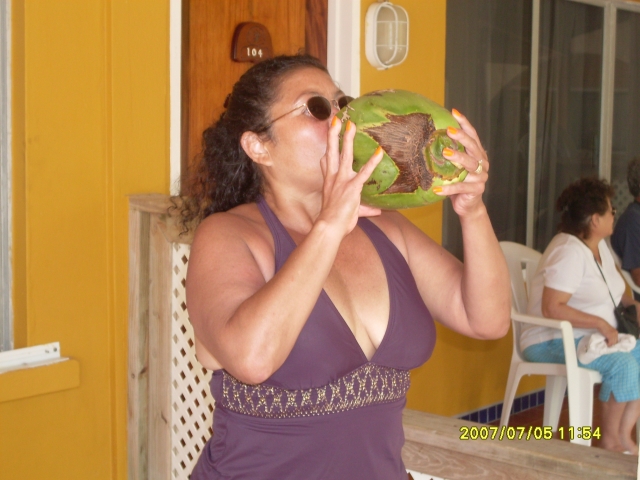 Estela enjoying a coconut in Belize